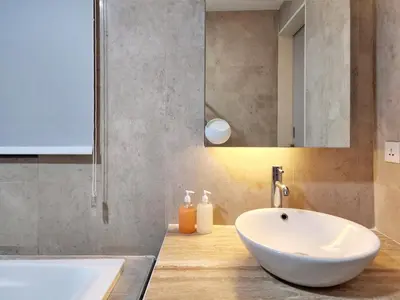 a bathroom with a white sink and a mirror at Bukit Bintang Fairlane Residence Kuala Lumpur #1510 in Kuala Lumpur