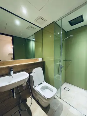 a bathroom with a toilet and a sink and a shower at URBAN COMFY HOME at SkySuites Near KLCC Complimentary Breakfast in Kuala Lumpur