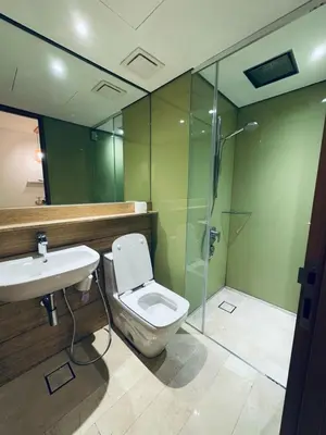 a bathroom with a toilet and a sink and a shower at URBAN COMFY HOME at SkySuites Near KLCC Complimentary Breakfast in Kuala Lumpur