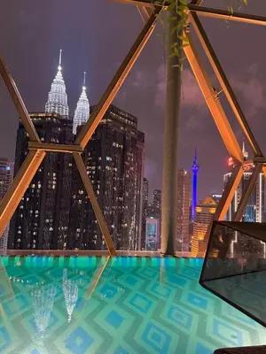 a view of the city from the top of a building at Scarletz Suites KLCC by TaheeenS in Kuala Lumpur