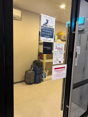 a room with luggage and signs in a store at Scarletz Suites KLCC by TaheeenS in Kuala Lumpur