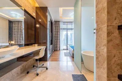 a bathroom with a tub and a sink and a toilet at Dorsett Residence Kuala Lumpur #21 in Kuala Lumpur