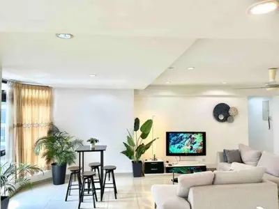 a living room with a couch and a table at LATEST facing Pavilion main entrance in Kuala Lumpur