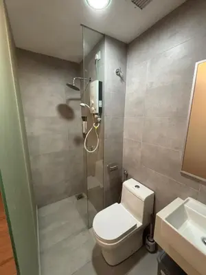a bathroom with a shower and a toilet and a sink at Riveria City in Kuala Lumpur