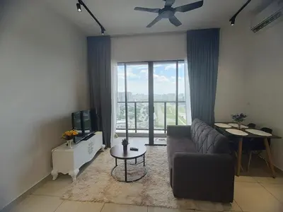 a living room with a couch and a large window at Trion Residence Kuala Lumpur by Azure in Kuala Lumpur