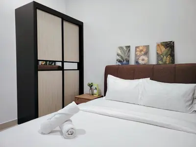 a bedroom with a bed with a towel on it at Trion Residence Kuala Lumpur by Azure in Kuala Lumpur