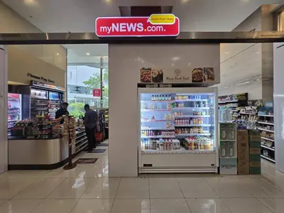 a grocery store aisle with a refrigerator in a store at Binjai 8 KLCC in Kuala Lumpur