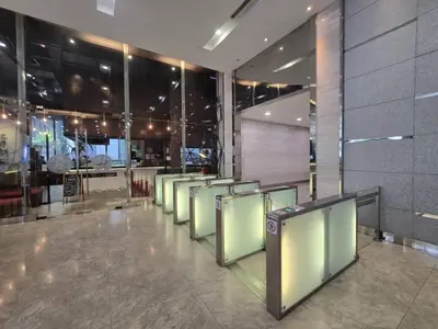 a row of chairs are lined up in a building at Binjai 8 KLCC in Kuala Lumpur