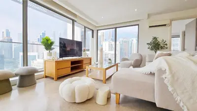 a bedroom with a large window with a view of the city at Skyview Bukit Bintang Fairlane Residence #24 in Kuala Lumpur