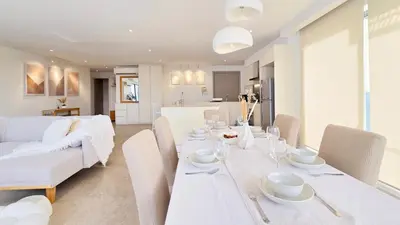 a dining room and living room with a table and chairs at Skyview Bukit Bintang Fairlane Residence #24 in Kuala Lumpur