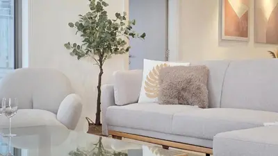 a living room with a couch and a chair at Skyview Bukit Bintang Fairlane Residence #24 in Kuala Lumpur