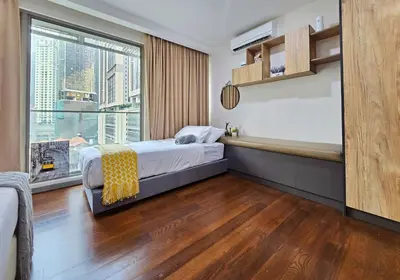 a bedroom with a bed and a large window at Bukit Bintang Fairlane Residence #81 Pavilion Kuala Lumpur in Kuala Lumpur