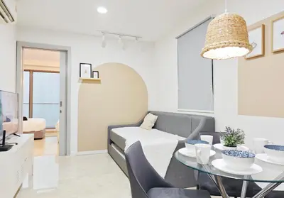 a living room with a table and a couch at Bintang Fairlane Residence #83 KLCC Pavilion in Kuala Lumpur