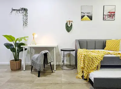 a living room with a couch and a table at Bukit Bintang Fairlane Residence #199 KL TRX Pavilion in Kuala Lumpur
