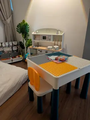 a toy kitchen with a table and a bed at Family Suite M Vertica Sunway Velocity Ikea KL MRT in Kuala Lumpur