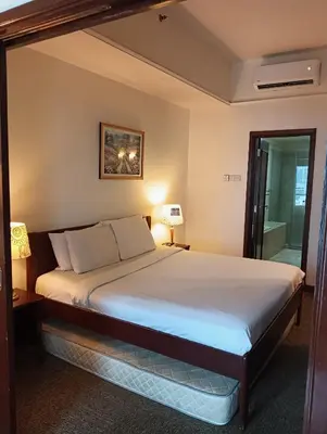 a bedroom with a large bed in a room at KL Marigold Apartment At Times Square in Kuala Lumpur