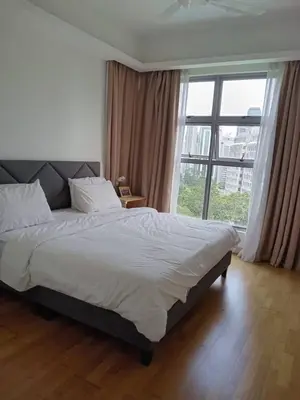 a bedroom with a large bed and a large window at Luxury Balcony Suites- Homestay in Kuala Lumpur