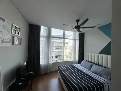 a bedroom with a bed and a ceiling fan at KLCC Private Bedroom in DUAL KEY Unit in Kuala Lumpur