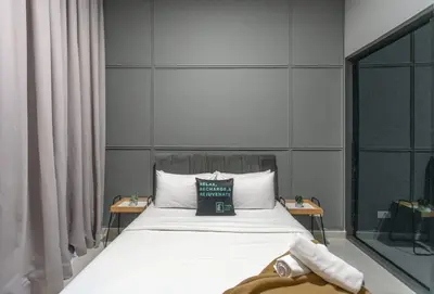 a bedroom with a bed with a pillow on it at The Colony & Luxe Kuala Lumpur with Skypool by Cobnb in Kuala Lumpur