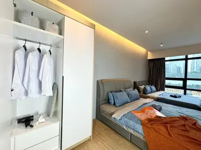a bedroom with a bed and a couch and a window at The Benton - Bangsar Trade Centre in Kuala Lumpur
