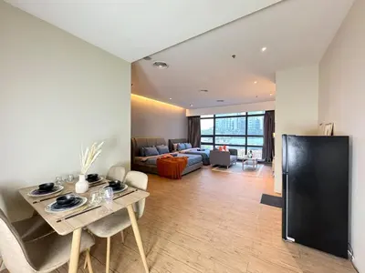 a large living room with a couch and a table at The Benton - Bangsar Trade Centre in Kuala Lumpur