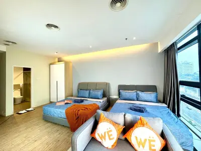 a living room with two beds and a couch at The Benton - Bangsar Trade Centre in Kuala Lumpur