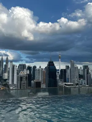 a view of a city from the rooftop of a building at Stay at Regalia KLCC View Sky Pool in Kuala Lumpur