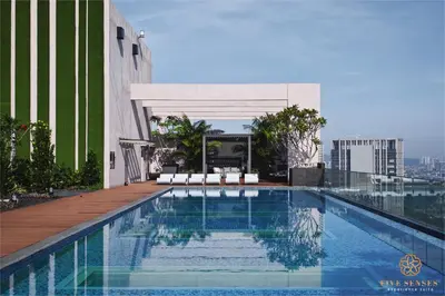 a swimming pool on the roof of a building at Riveria Signature Suites, KL Sentral in Kuala Lumpur