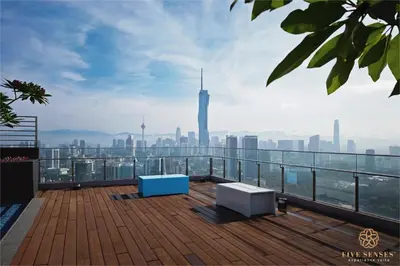 a balcony with a view of the city at Riveria Signature Suites, KL Sentral in Kuala Lumpur