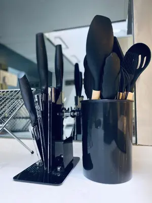 a black container filled with utensils on a counter at Summer Suites KLCC by EASY STAY in Kuala Lumpur