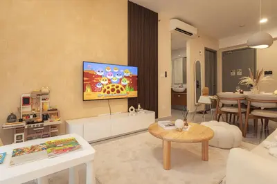 a living room with a tv on a wall at Agile Bukit Bintang in Kuala Lumpur