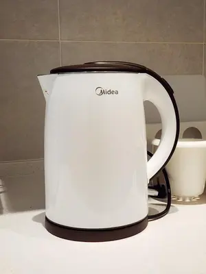 a white toaster sitting on top of a counter at Flora Residency KL -- Botanical Vibes #3BR2B #1-7 pax by Cowidea in Kuala Lumpur