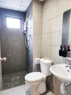 a bathroom with a toilet and a sink at Flora Residency KL -- Botanical Vibes #3BR2B #1-7 pax by Cowidea in Kuala Lumpur