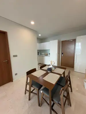 a dining room with a wooden table and chairs at URBAN SKY HOME NEAR KLCC Complementary Breakfast in Kuala Lumpur