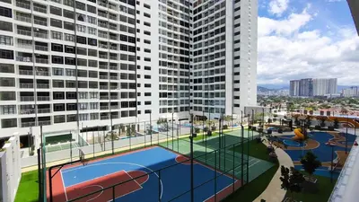 an apartment complex with a basketball court in front of a building at LSH33 Residence Sentul KL by HomeBrickz in Kuala Lumpur