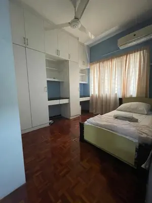 a bedroom with a bed and a wooden floor at Condo in kuala lumpur in Kuala Lumpur