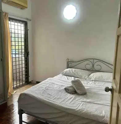 a bedroom with a white bed and a window at Condo in kuala lumpur in Kuala Lumpur