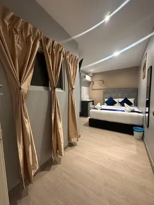 a bedroom with a bed with curtains in it at SS Grey inn Bukit Bintang in Kuala Lumpur