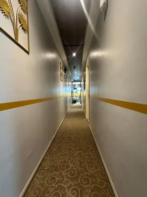 a long hallway with a long corridor at SS Grey inn Bukit Bintang in Kuala Lumpur