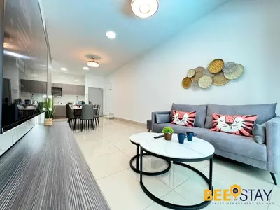 a living room with a couch and a table at Salak Selatan Pool View with Wifi & Netflix 4PAX in Kuala Lumpur
