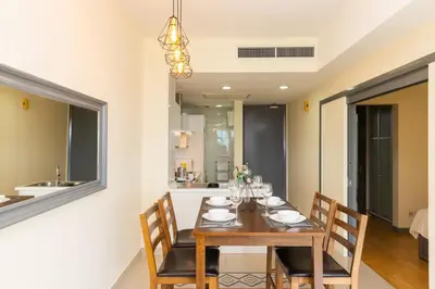 a dining room with a table and chairs at Publika Mont Kiara City View Suite - 8KM to KLCC in Kuala Lumpur