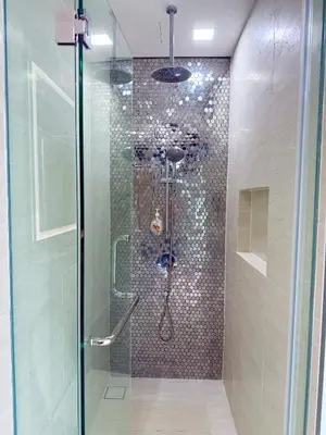 a shower with a glass door in a bathroom at Star Suites KLCC by flixses in Kuala Lumpur