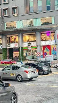 a group of cars parked in front of a building at The Atrium Ampang by OKBnB - Family Suite 3-Minute Access to the Heart of KL in Kuala Lumpur