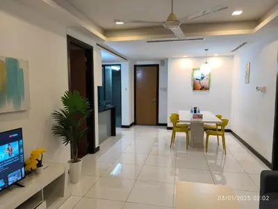 a living room with a table and chairs and a television at 0111 Sweet Home-Casa Residency 2R 2B City View in Kuala Lumpur