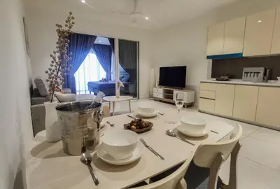 a kitchen and living room with a table and chairs at Quill Luxe Stay - KLCC in Kuala Lumpur