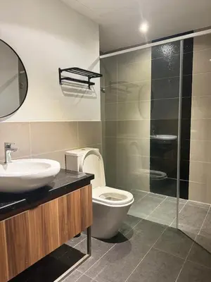 a bathroom with a toilet and a sink and a shower at Mid Valley & The Sphere BTC in Kuala Lumpur