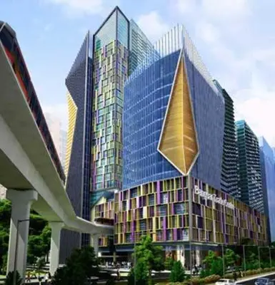 a large glass building with a kite hanging from it at Mid Valley & The Sphere BTC in Kuala Lumpur