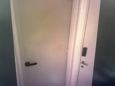a door with a rainbow painted on the wall at Pixel City Sentral Studio Walk to Lrt1Min KLCC in Kuala Lumpur