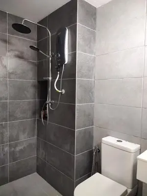 a bathroom with a shower with a phone on the wall at Vista Sentul WIFI AnDroidTV 8KM to KLCC in Kuala Lumpur