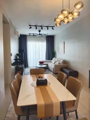 a living room with a table and a couch at Vista Sentul WIFI AnDroidTV 8KM to KLCC in Kuala Lumpur